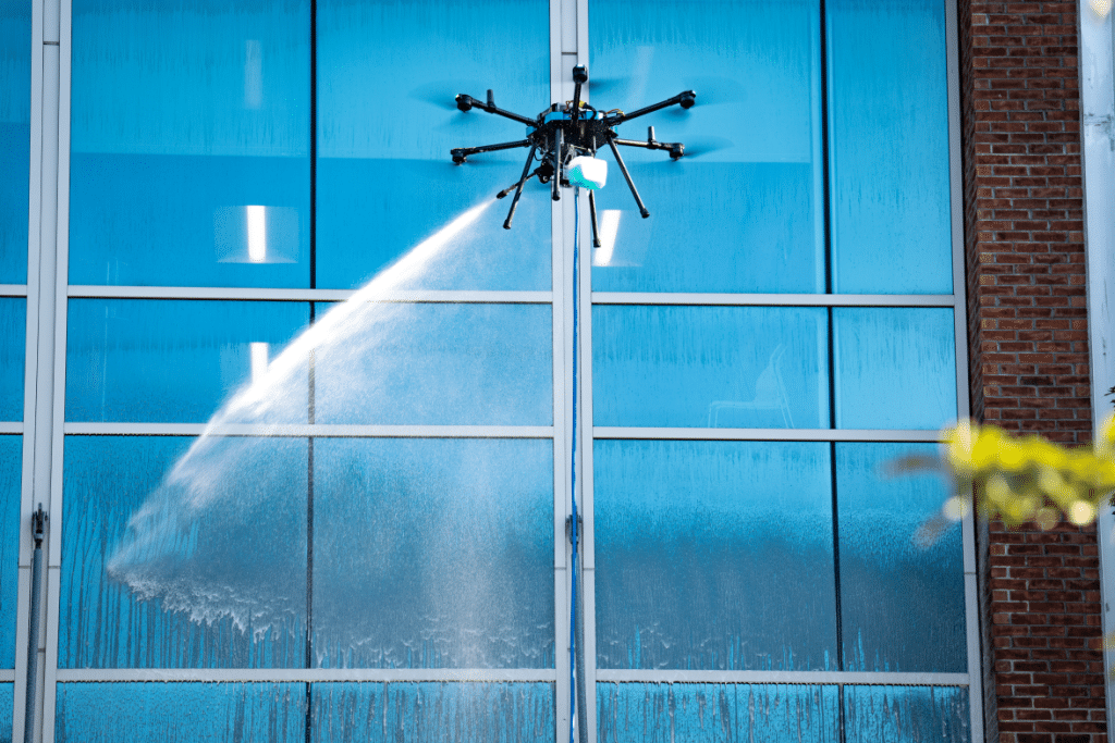 An image of pressure washing a high-rise building using drone