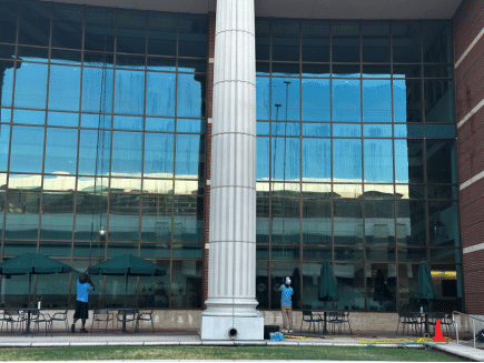 Workers from Bellah Cleaning Company offering commercial window cleaning service